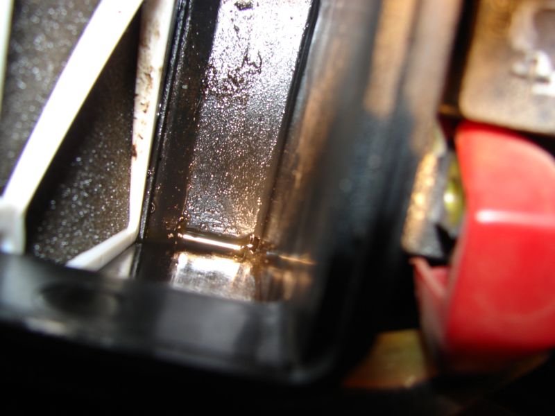 inside view of air filter assy with the drian hole in the bottom of the pic