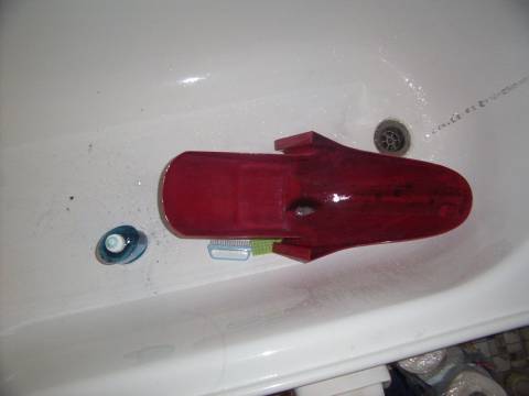 lots of degreaser (in the front yard) followed by heaps of scrubbing and detergent to clean it in the bath.