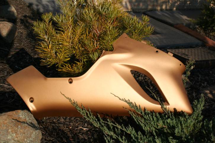 The pre decision test... This is the bit of old fairing from my old bike i used to see if I can get paint out ok....it was black plastic lower fairing off an 05 ZX6R