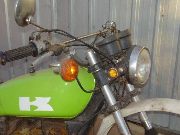 all the good stock bits are still there....headlight, reflectors, stock handlebars, levers, etc etc