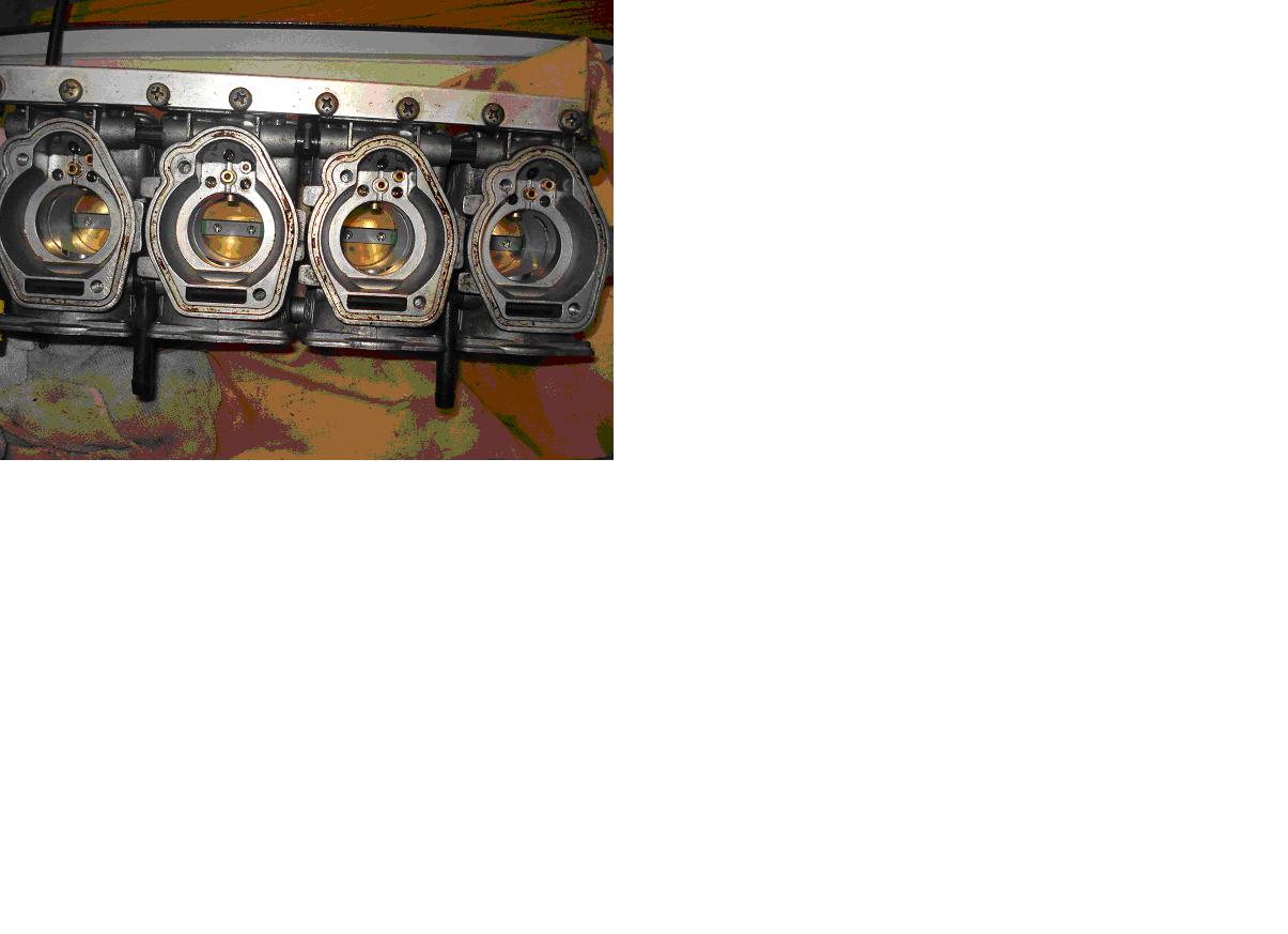 See the LHS carby, shorter inlet Nozzle into cylinder #1 throat ....