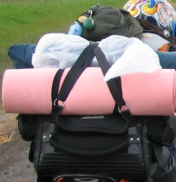 Thread straps thru the o rings to tie load on top