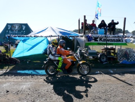 Rossi heading back to pits.