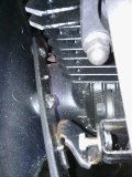 you can see the little bracket that bolts from the ferrin to the frame bracket, this bracket actually connected to one of the bolts that connects the belly pan and middle ferrin