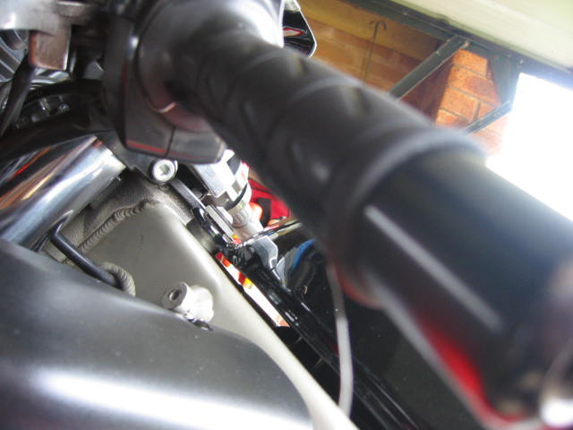 Run the wire to the outside, and then tape it. I found out it's nicer to run the length under the grip.